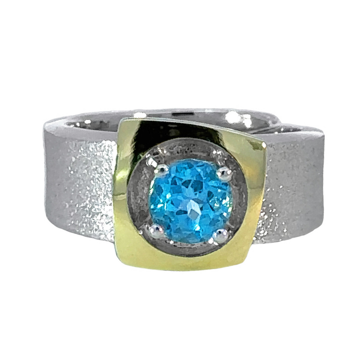 Anillo de plata, oro y topacio