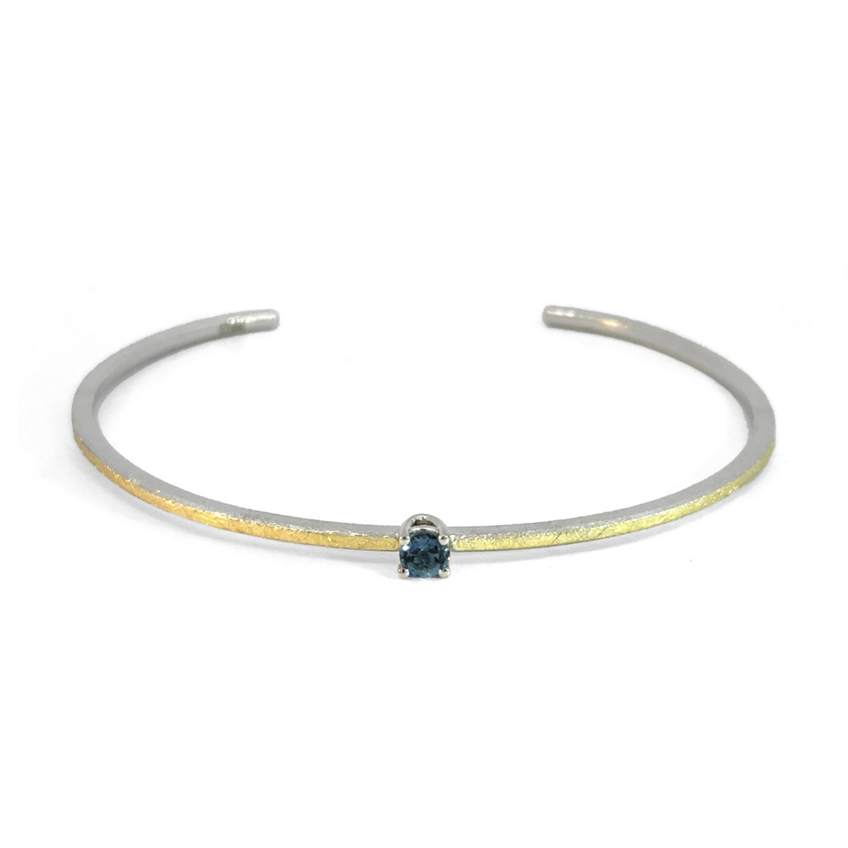 Silver, gold and topaz bracelet