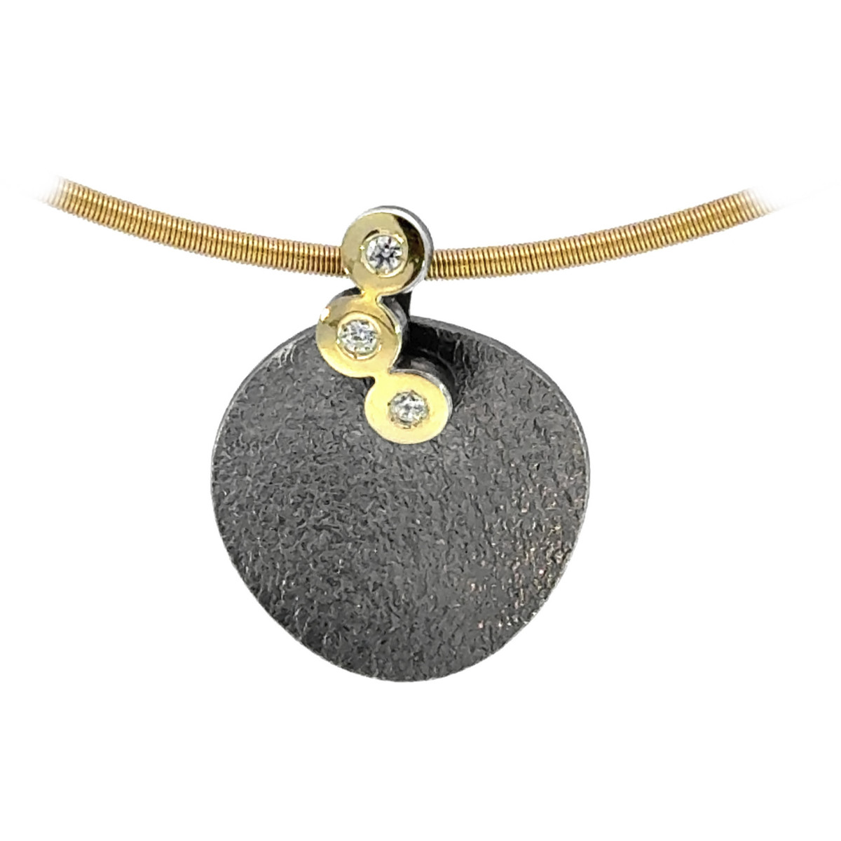 Silver, gold and diamond pendant