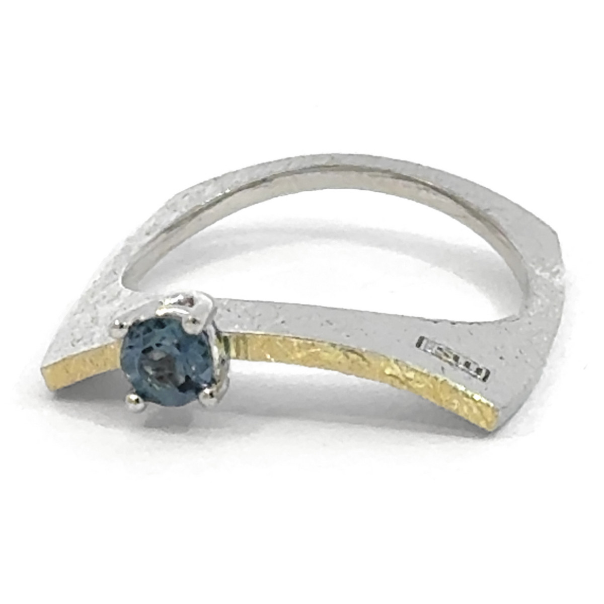 Silver, gold and topaz ring