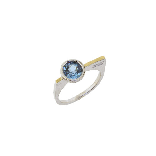 Silver, gold and blue topaz ring