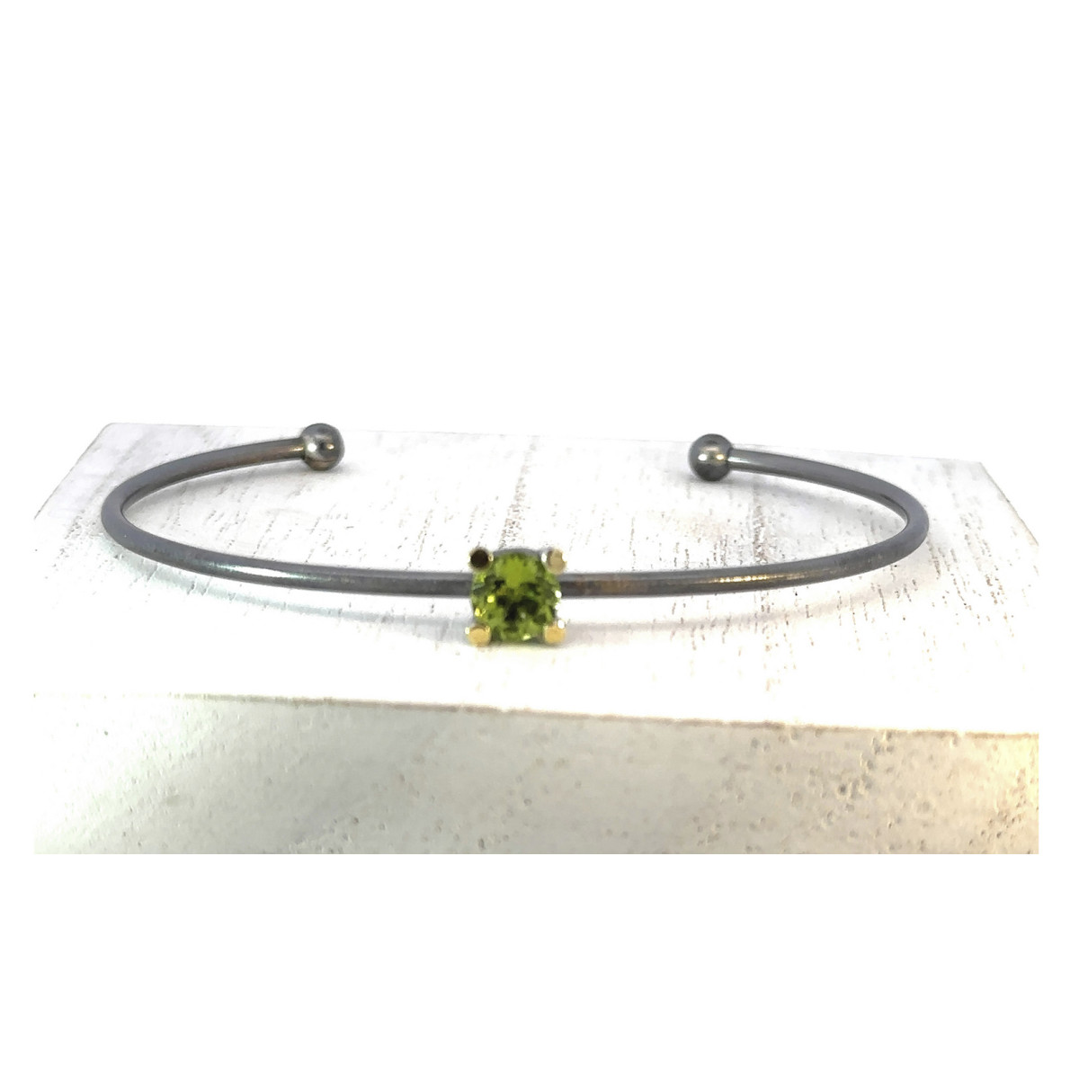 Silver, gold and peridot bracelet