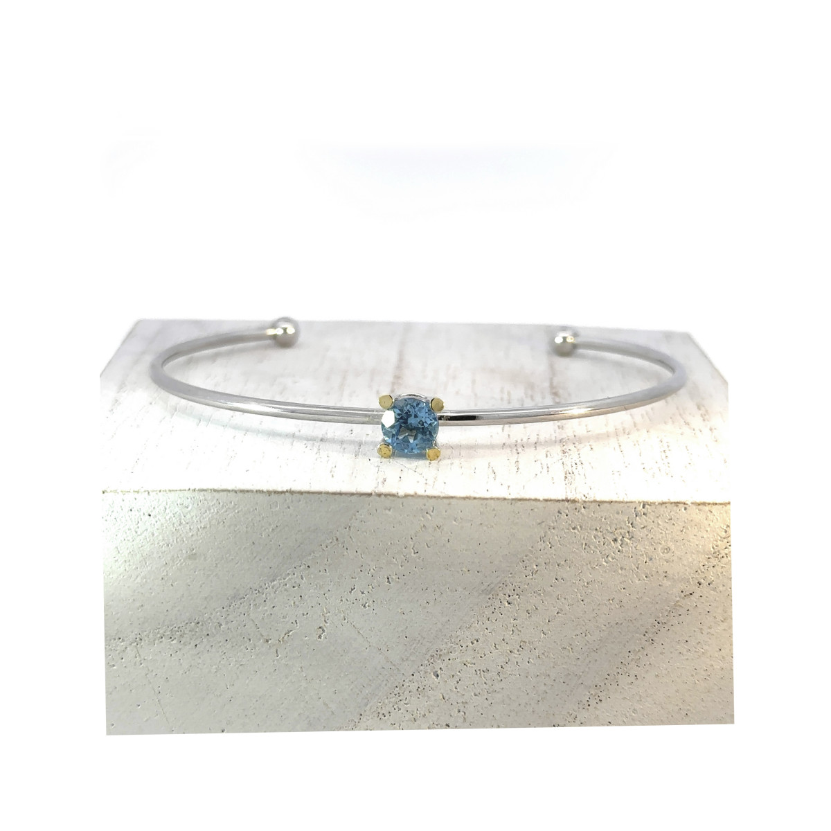 Polsera de plata, or i topaci