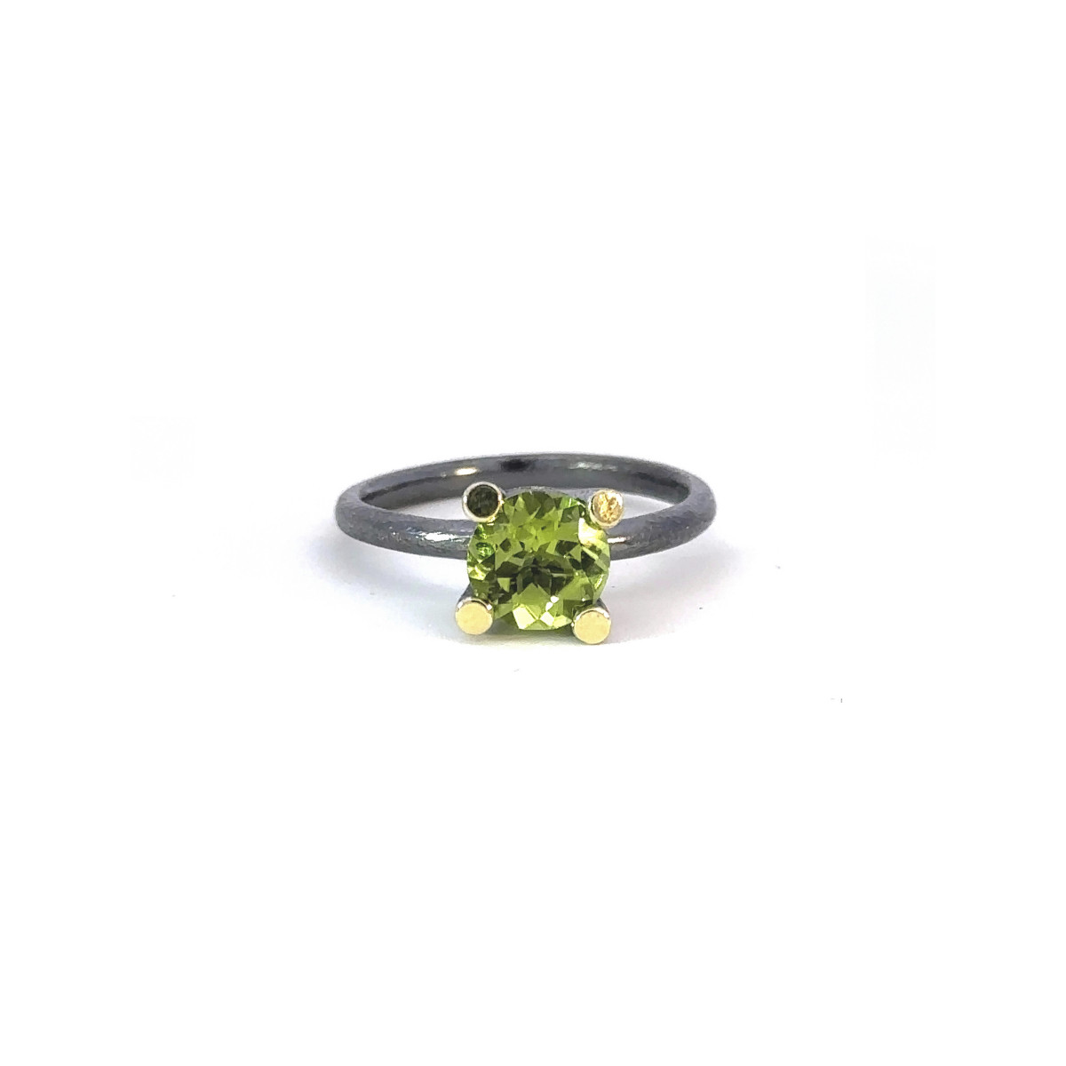 Silver, gold and peridot ring