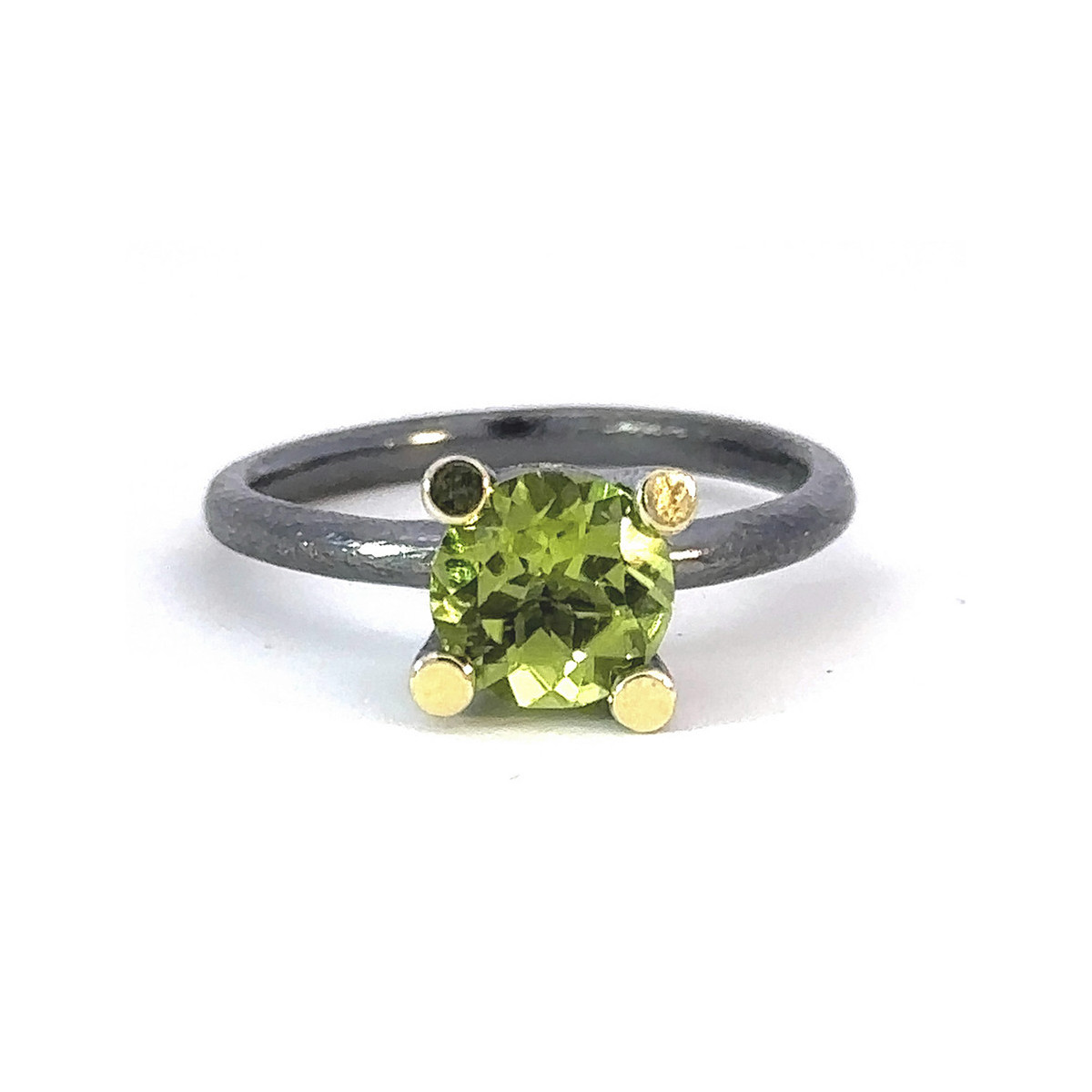 Silver, gold and peridot ring